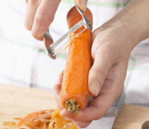 Man peeling carrots